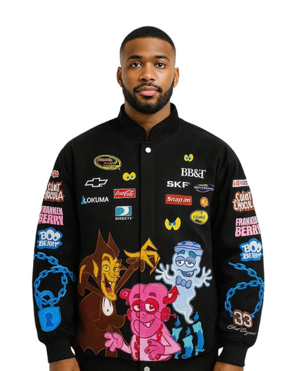 Man wearing a black jacket with colorful graphics and brand logos on a white background