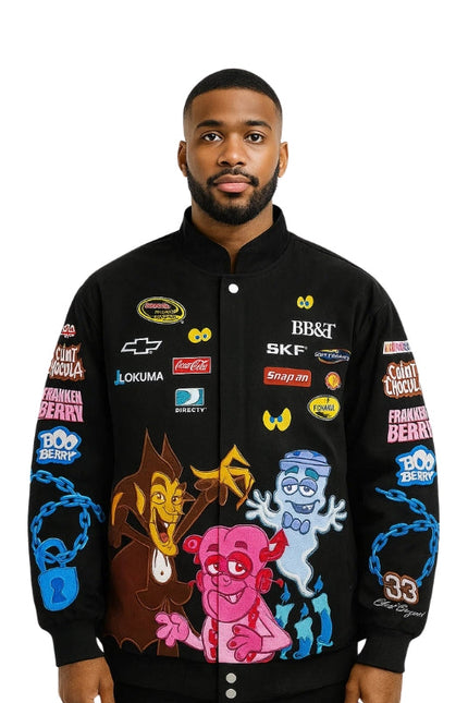 Man wearing a black jacket with colorful graphics and brand logos on a white background