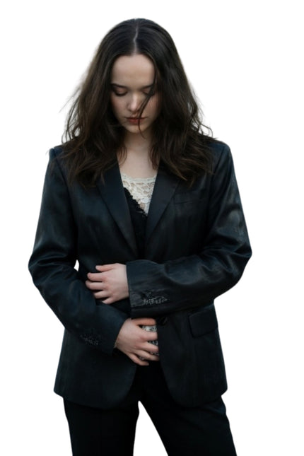 Woman wearing a black suit on a white background