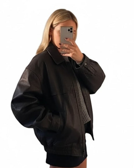 Person wearing a black jacket with a white background