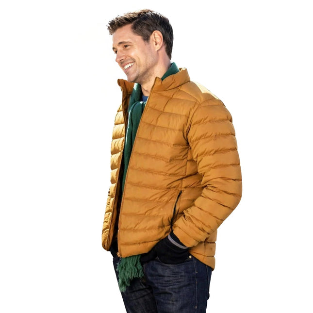 Man wearing a mustard yellow puffer jacket on a white background