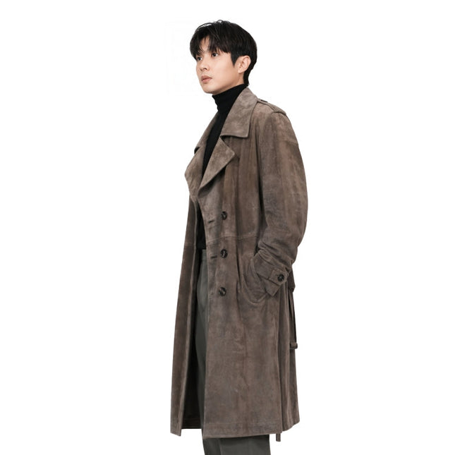 Man wearing a brown trench coat on a white background