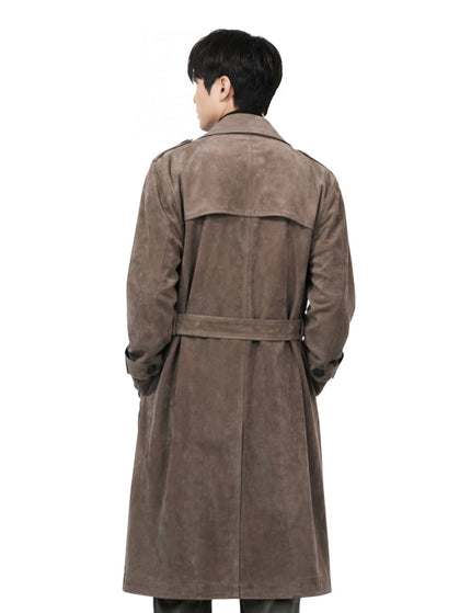 Man wearing a brown trench coat on a white background