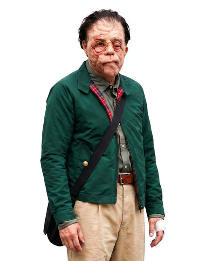 Man wearing a green jacket with a black strap over his shoulder on a white background