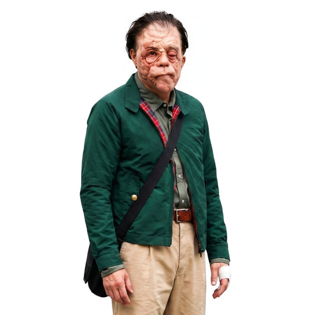 Man wearing a green jacket with a black strap over his shoulder on a white background