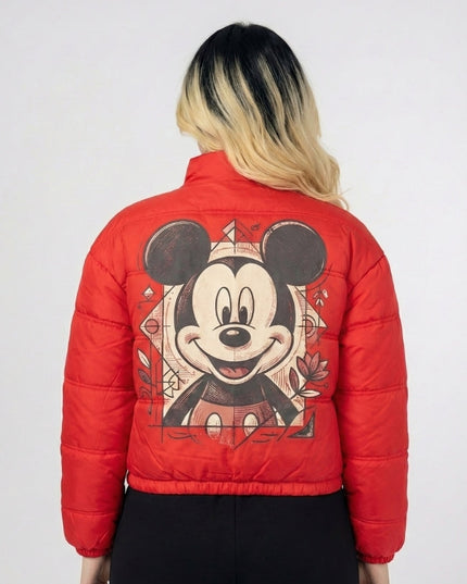 Red puffer jacket with a cartoon character design on the back, worn by a person.