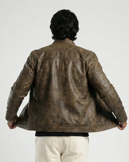 Person wearing a brown leather jacket on a white background