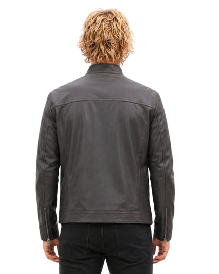 Person wearing a gray leather jacket on a white background