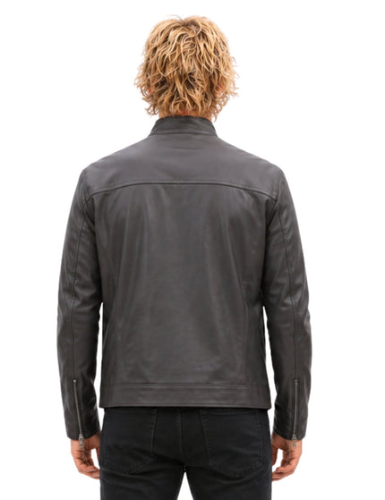 Person wearing a gray leather jacket on a white background