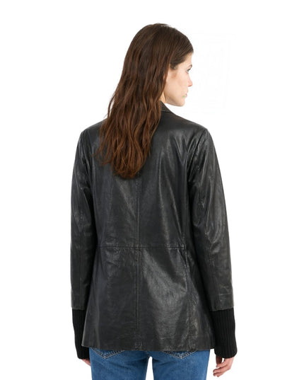 Woman wearing a black leather jacket on a white background