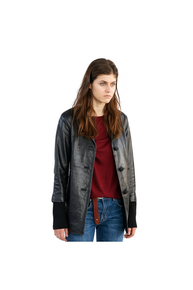 Woman wearing a black leather jacket over a red shirt and blue jeans on a white background