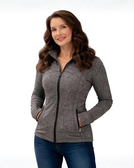 Woman wearing a gray zip-up jacket on a white background