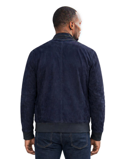 Man wearing a blue suede jacket on a white background 