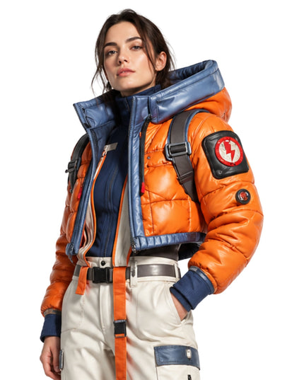 Person wearing an orange and blue jacket with a backpack on a white background