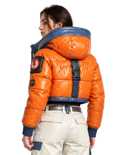 Person wearing an orange puffer jacket with a blue hood on a white background