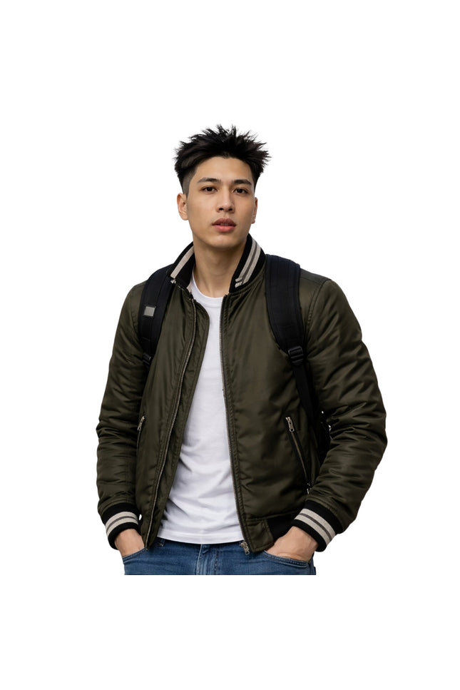 Man wearing a green bomber jacket with a white shirt and blue jeans on a white background
