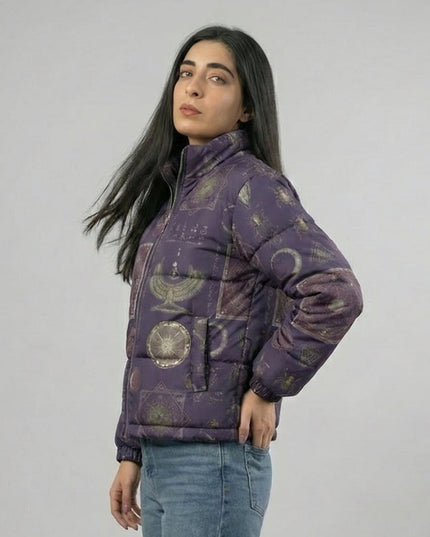 Woman wearing a purple patterned jacket against a plain background