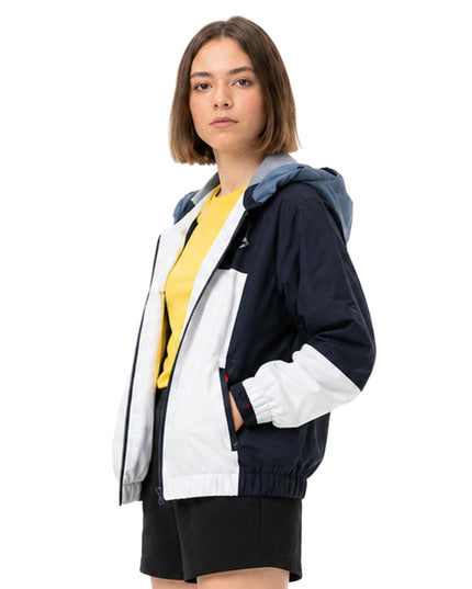 Woman wearing a colorful jacket with a white background