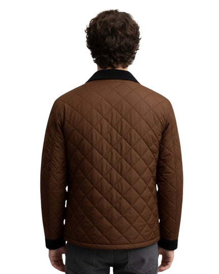 Man wearing a brown quilted jacket on a white background