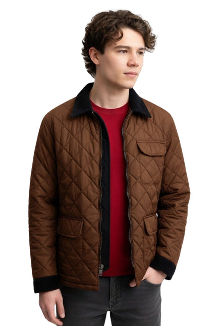 Man wearing a brown quilted jacket over a red shirt on a white background