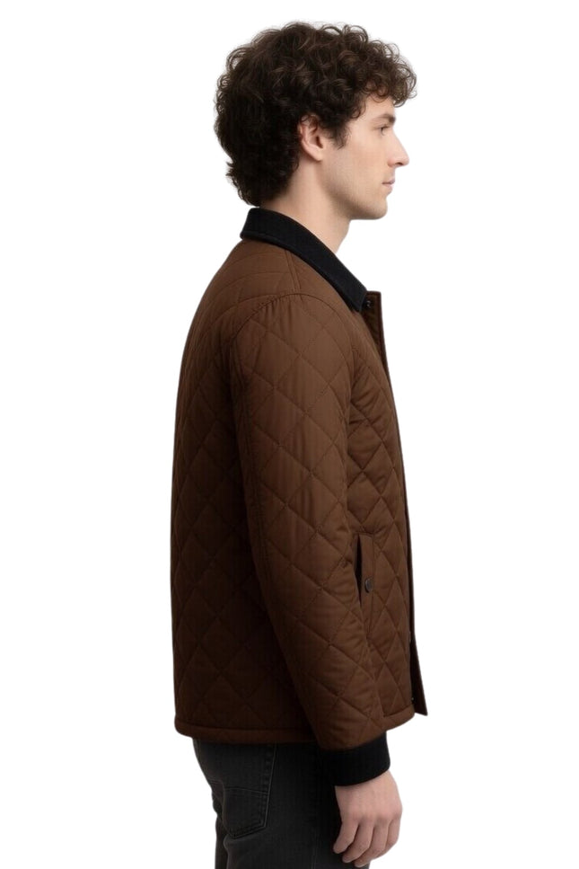 Man wearing a brown quilted jacket on a white background