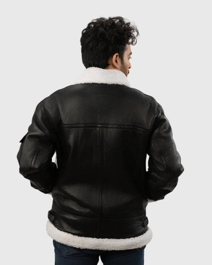 Person wearing a black leather jacket with white fur lining on a white background