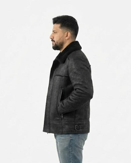 Man wearing a dark leather jacket with fur collar on a white background