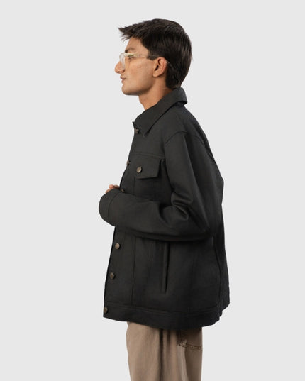 Man wearing a black jacket on a white background