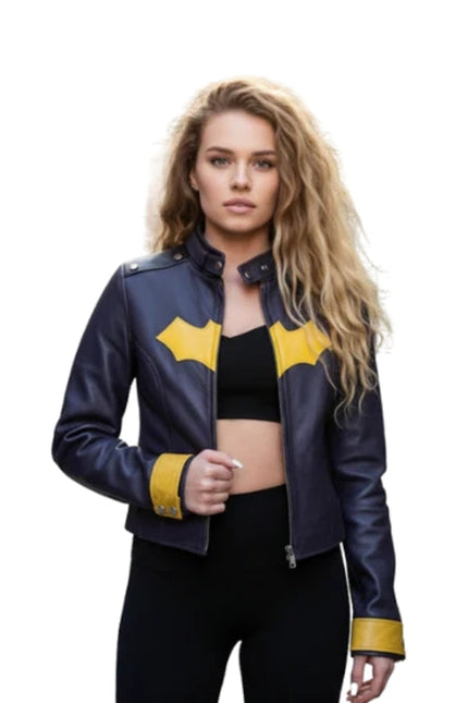 Woman wearing a blue leather jacket with yellow accents on a white background