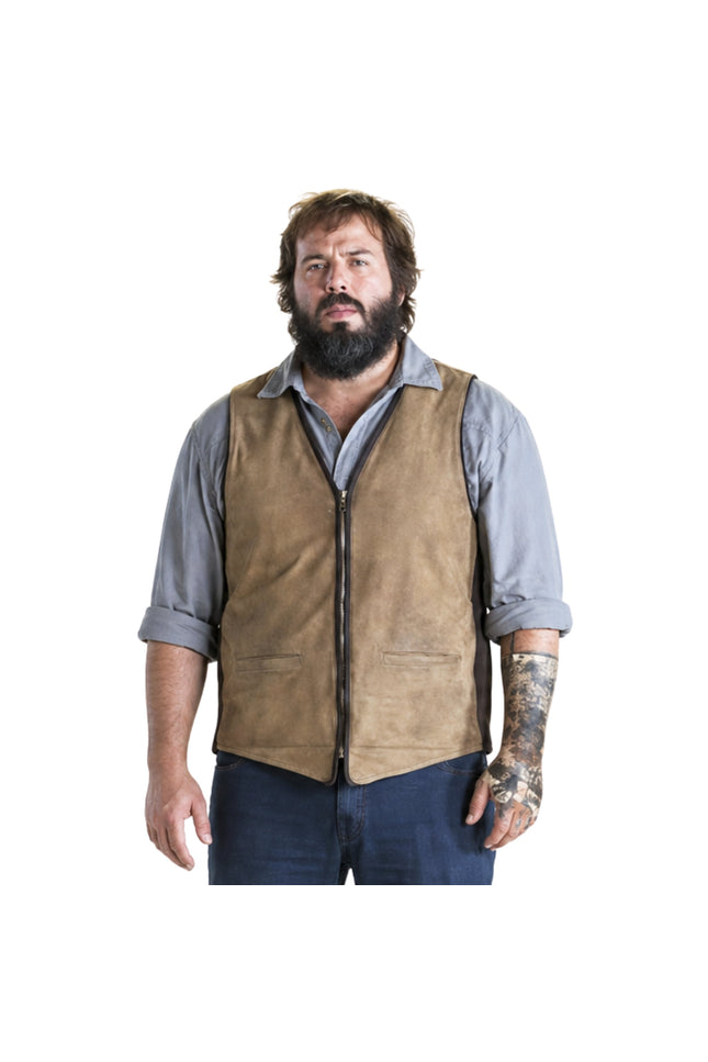 Man wearing a brown vest over a gray shirt on a white background