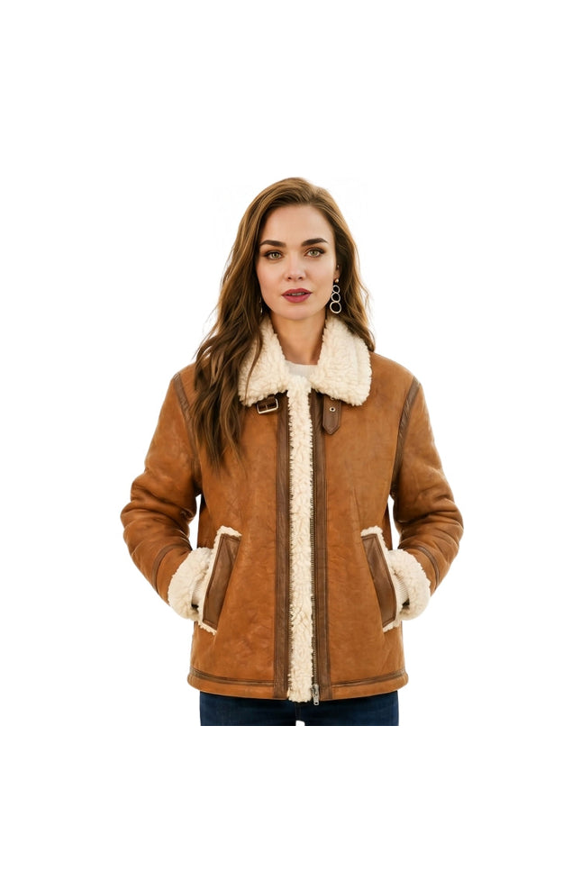 Woman wearing a brown shearling jacket with white fur lining on a white background