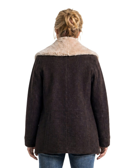 Brown coat with fur collar worn by a person on a white background