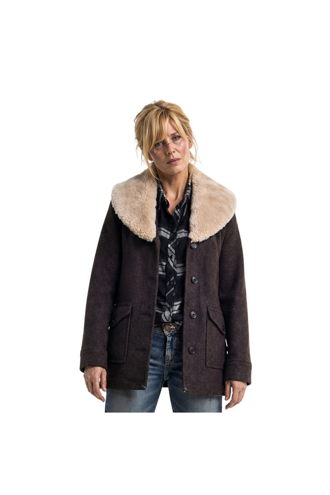 Woman wearing a brown coat with a fur-lined collar on a white background