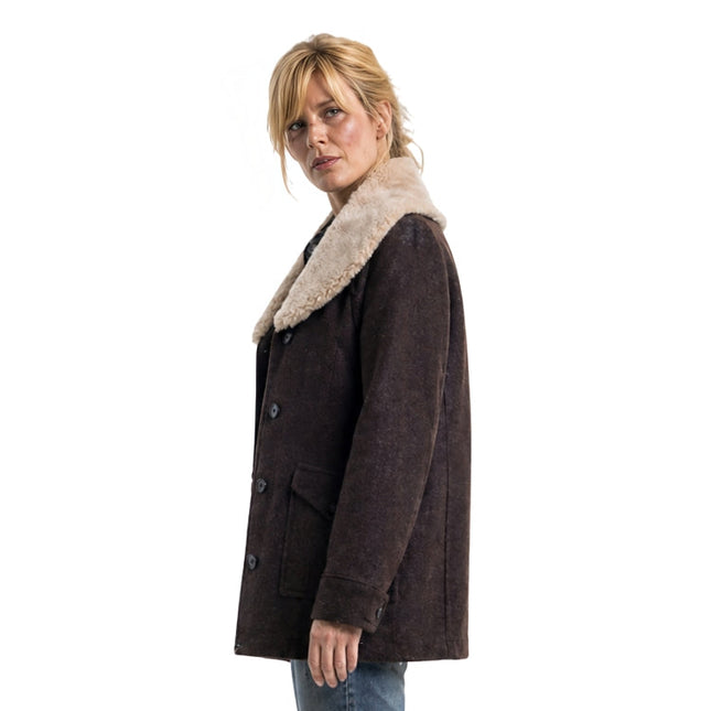 Woman wearing a brown coat with a fur collar on a white background