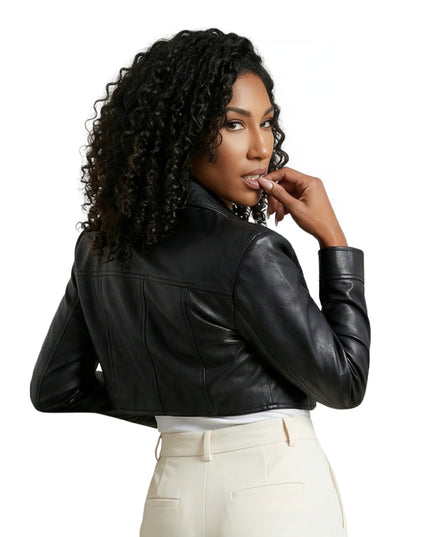 Woman wearing a black leather jacket on a white background