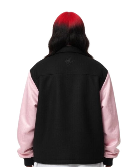 Person wearing a black and pink jacket on a white background