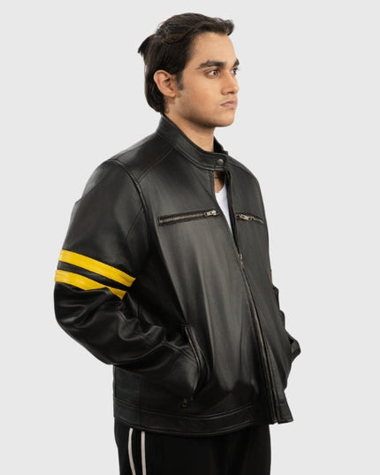 Man wearing a black leather jacket with yellow stripes on a white background