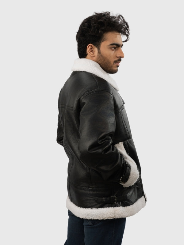 Man wearing a black leather jacket with white fur lining on a white background