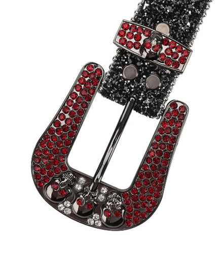 Belt buckle with red gemstones and black metal on a white background