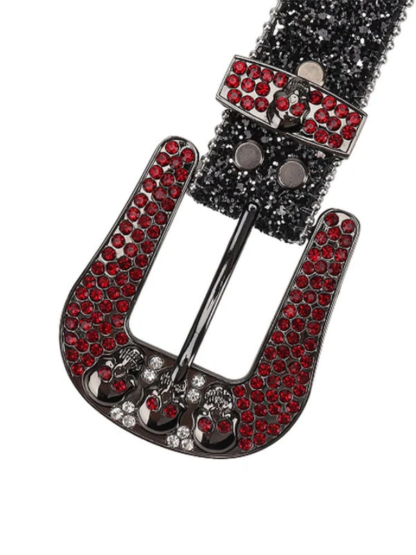 Belt buckle with red gemstones and black metal on a white background