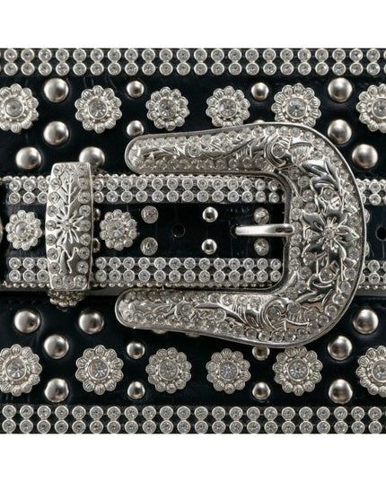 Decorative belt with silver buckle and floral patterns on a black background