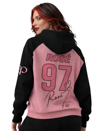 Person wearing a black and pink hoodie with 'ROSE 97' text on the back.