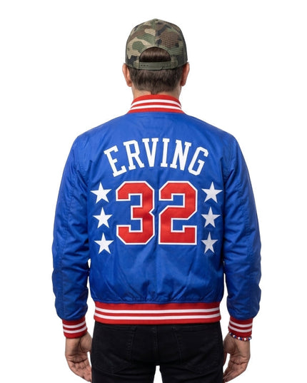 Person wearing a blue jacket with 'E. Irving 32' on the back, standing against a white background