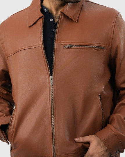 Brown leather jacket worn by a person on a white background