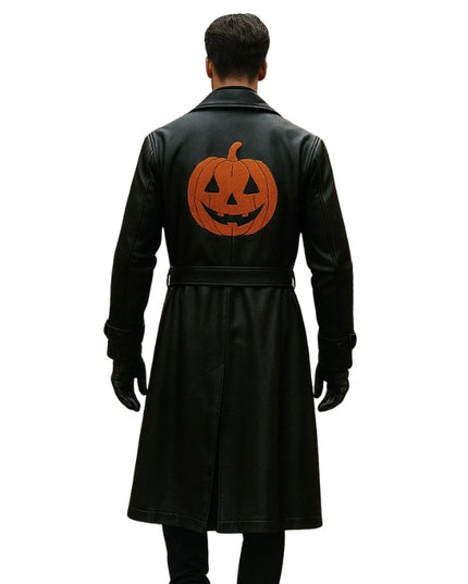 Black coat with a pumpkin design on the back worn by a person on a white background