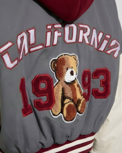 Gray jacket with teddy bear and 'California 1993' text on a plain background