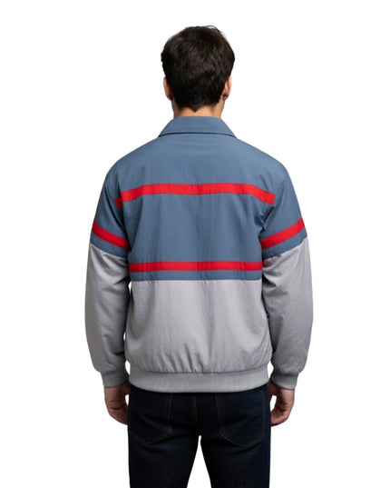 Person wearing a gray jacket with red stripes on a white background