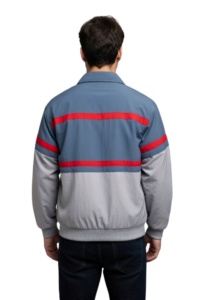 Person wearing a gray jacket with red stripes on a white background