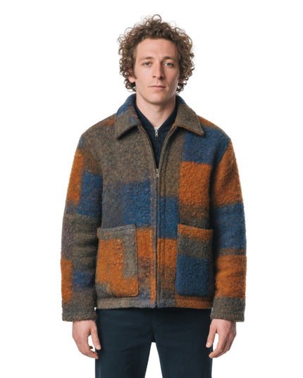 Man wearing a patterned jacket on a white background