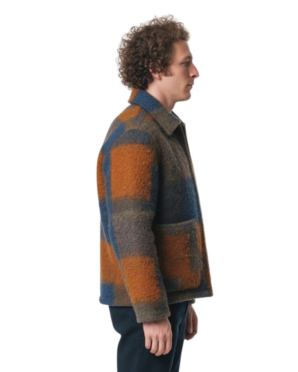 Man wearing a plaid jacket on a white background